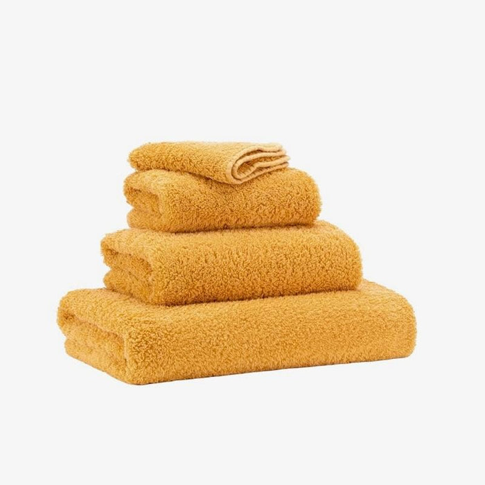 Abyss Super Pile Wash Cloth 12x12 Curcuma 870 - View 2 at Fig Linens and Home