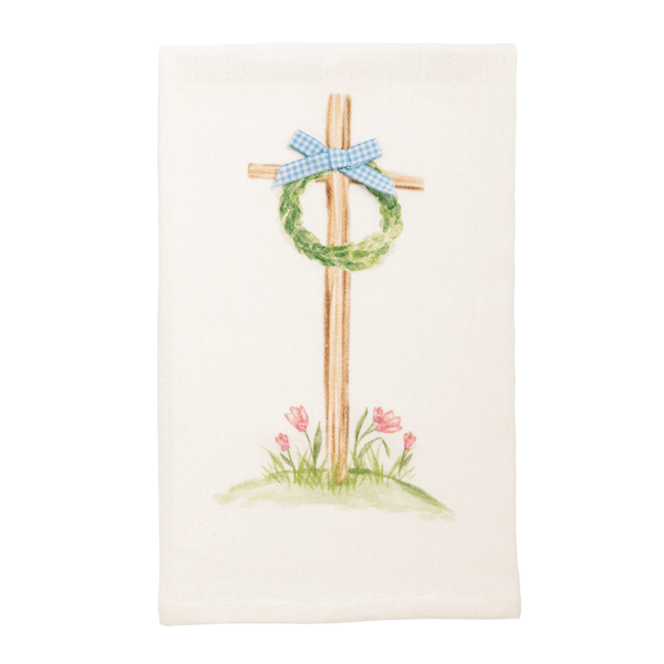 Decorative towel with a cross, wreath, and bow design on a white background