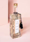 lollia elegance bubble bath on a pink background