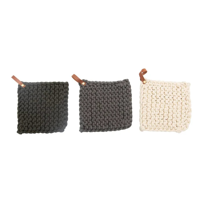 hand crocheted cotton pot holder with a cream background