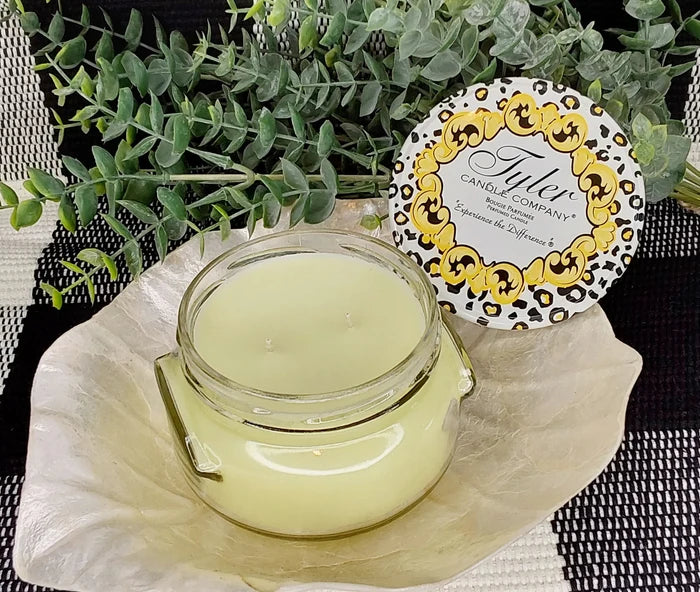 tyler candle company candle on a white leaf