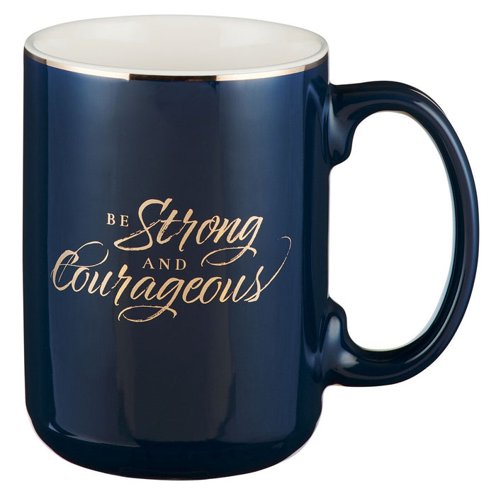 Navy blue mug with 'Be Strong and Courageous' text in gold on a white background